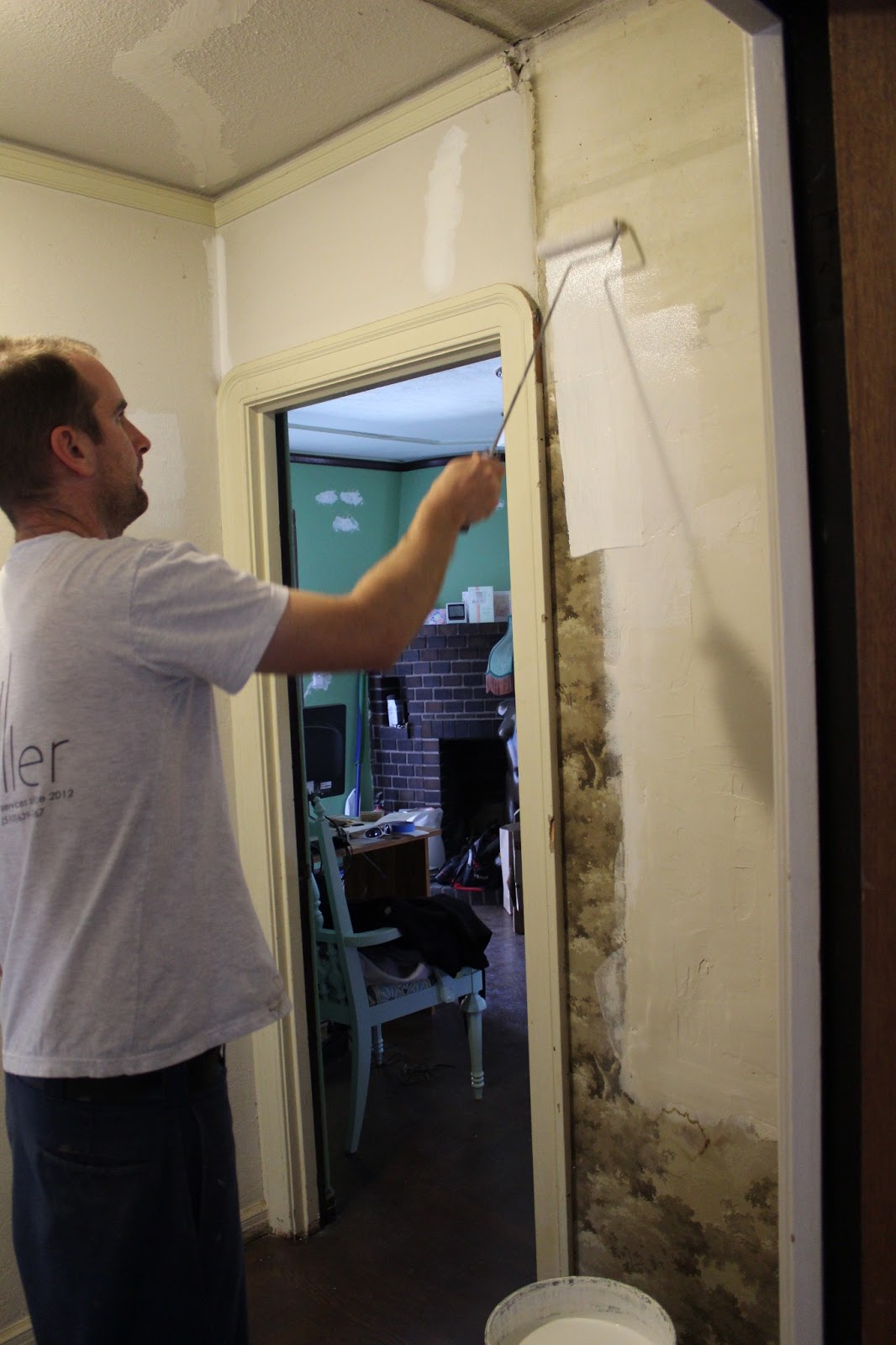 ... here he primed over the wallpaper before a final skim coat and texture