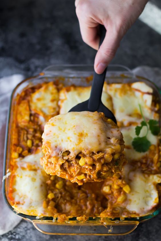 Cauliflower Rice Chicken Enchilada Casserole is a lower carb version of a favorite comfort food! Just six simple ingredients required.