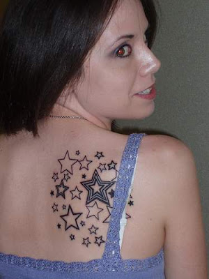 butterfly tattoos on upper back. upper back star tattoos.