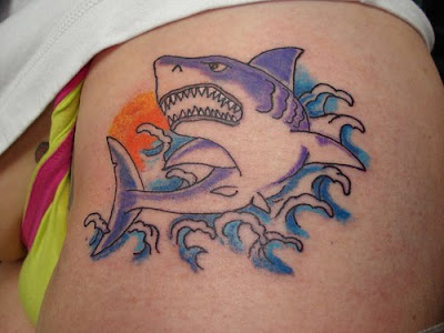 bow tattoo on thigh. Now-shark tattoo on thigh