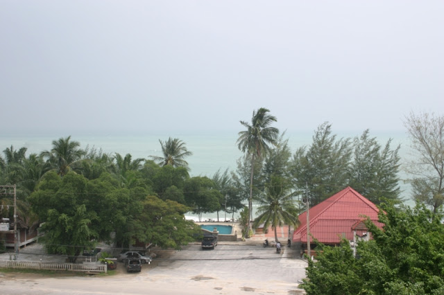 Nai Ploa Beach view of cottages & ocean in front of our hotel balcony.