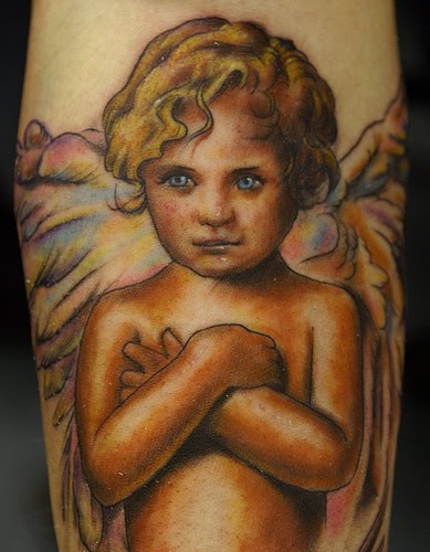 Colorful cherub tattoo.