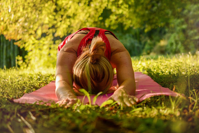 Woman Stretching on Yoga Mat