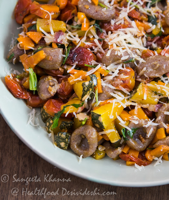 whole grain pasta with pumpkin carrots and cherry tomatoes 