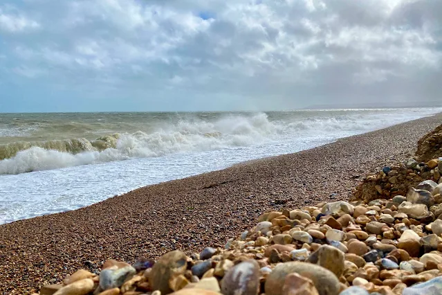 Pevensey Bay beach has lots of stones and a steep slope in places, but sand at low tiide