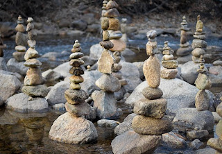 photo of many cairns built on rocks on the Boulder Creek