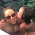  Mariah Carey gets loving kisses from daughter as they swim together