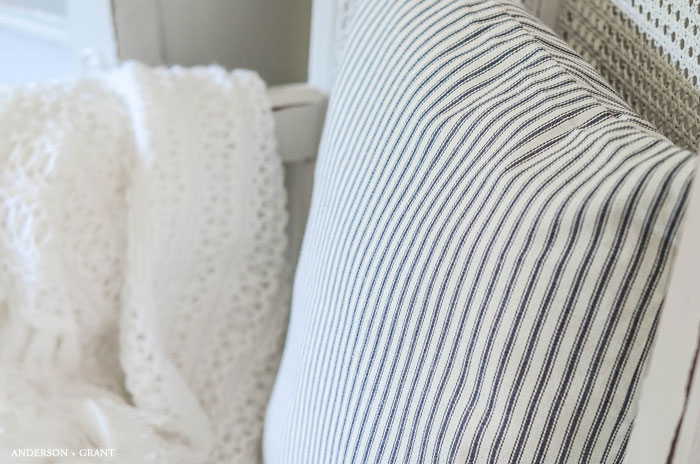 One of the easiest sewing projects you can try is making a pillow.   This tutorial teaches how to make an envelope pillow cover which requires just  some simple cutting and a few straight stitches.   #DIY #sewingbasics #farmhousediy #pillow #tutorial