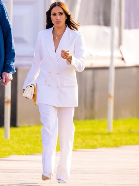 Meghan Markle wore a new oversized double-breasted twill blazer by Valentino, and with white matching trousers by Valentino