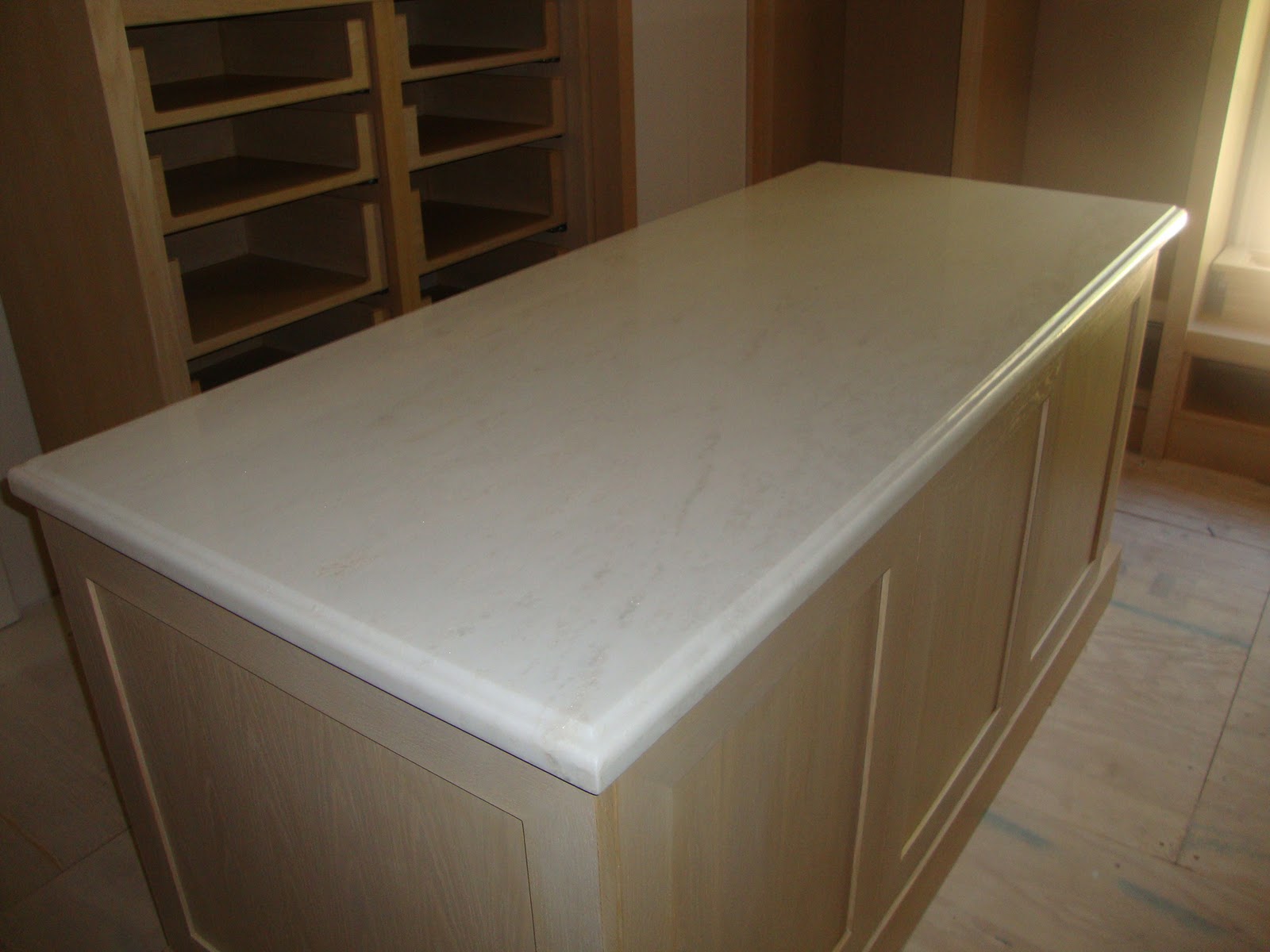 Guest Bathroom in Green Forest Slabs and Oolitic Limestone Mosaic title=