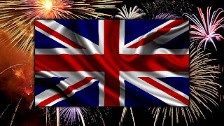 Image of the British flag in front of a sky with fireworks