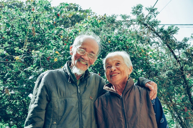 A smiling older couple