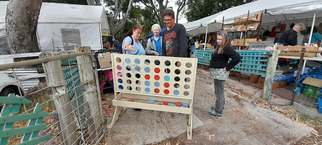 Enigma and my Brother play a giant game of Connect Four.