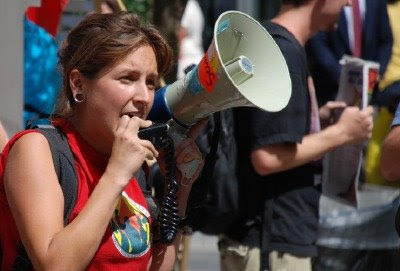 Woman with a megaphone on the 16th Street Mall, Denver