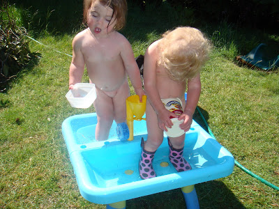 My Beautiful Family: The kids playing outside in the water!