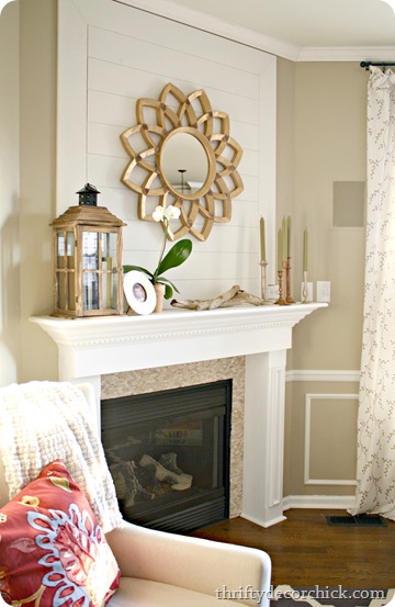 wood plank wall fireplace starburst mirror