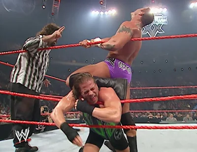 WWE Armageddon 2002 - Randy Orton puts a hurting on RVD while being admonished by referee Mick Foley