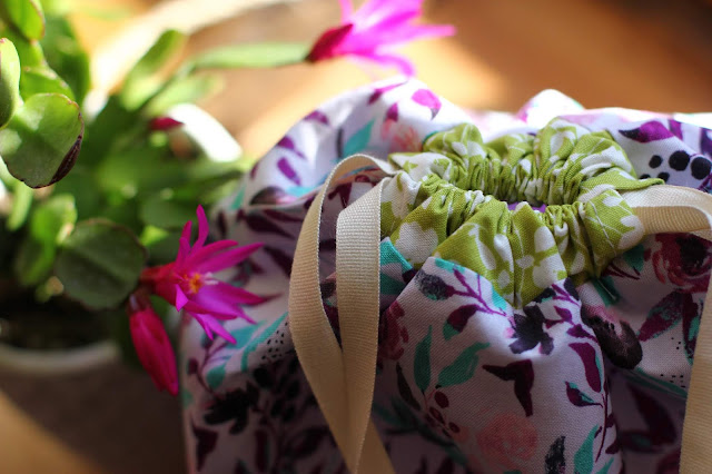 Close-up of top chartreuse floral drawstring channel all puckered up with drawstrings pulled.