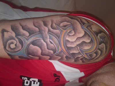 chest tattoos of clouds. Tribal tattoo with clouds