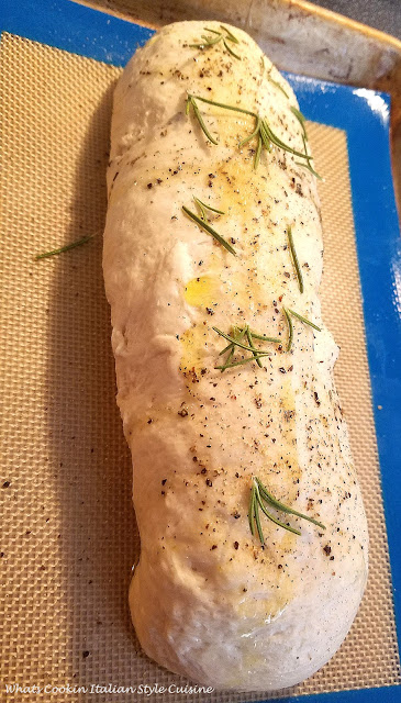 This is delicious pizza dough stuffed with cheese and fresh herbs. A  homemade bread dough that was mom's recipe. This is called a focaccia and italian herb bread that is stuffed with cheese. Rosemary is a main herb flavored in this bread along with black pepper and fresh basil