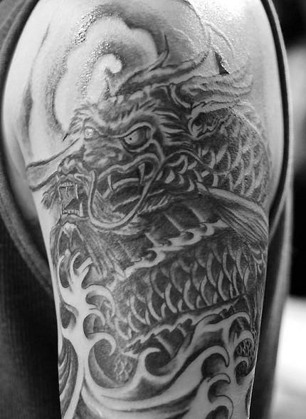 g dragon tattoo arm