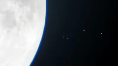 Amateur astronomer films 4 UFO Orbs flying to moon base.