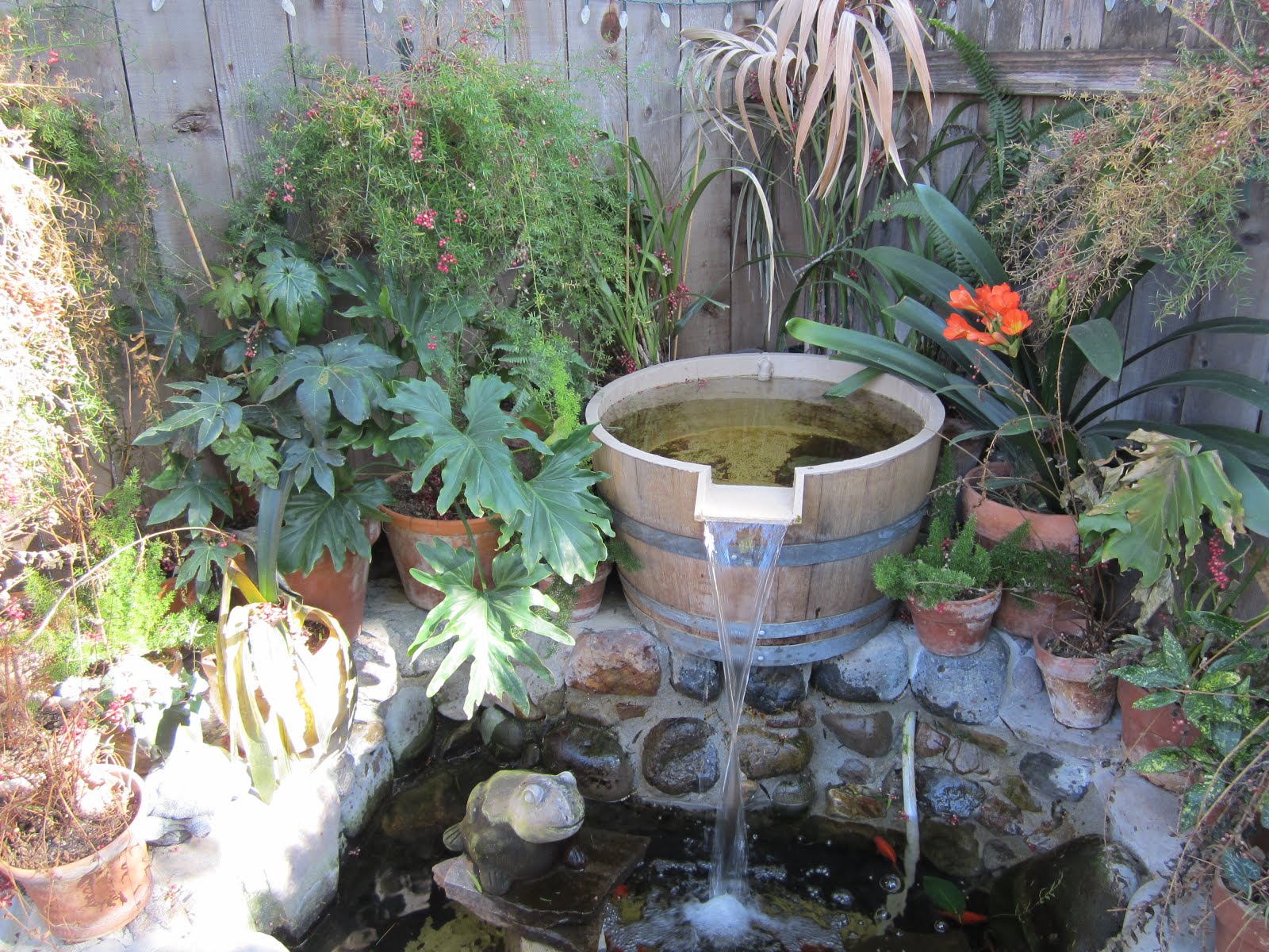 Backyard barrel fountain design, Fountain design, backyard design ideas, backyard fountain design