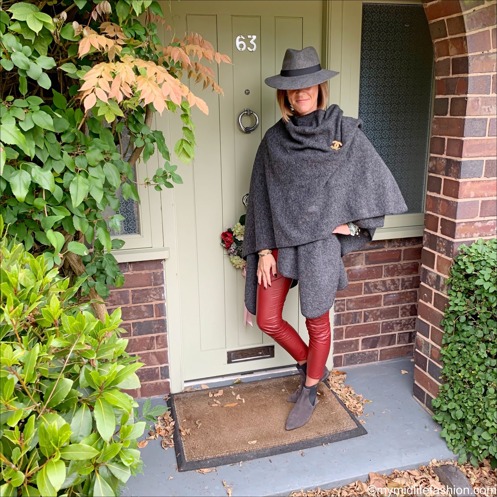 my midlife fashion, Zara felt fedora hat, Chanel vintage brooch, h and m cashmere sweatshirt jumper, Isabel Marant Etoile faux leather trousers, Madeleine fashion ankle boots, the sea company mindful stack bracelets, hope fashion the boiled wool blanket poncho