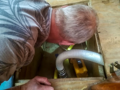 Photo of Phil fitting the transducer for the Fishfinder