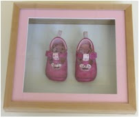 baby shoes in a frame