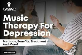 Person engaging in music therapy to relieve symptoms of depression through calming, therapeutic music.