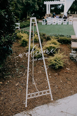 acrylic welcome sign for wedding on white easel