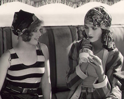 Seaside flappers Agnes Franey and Myrna Loy show off the latest 1929 beach