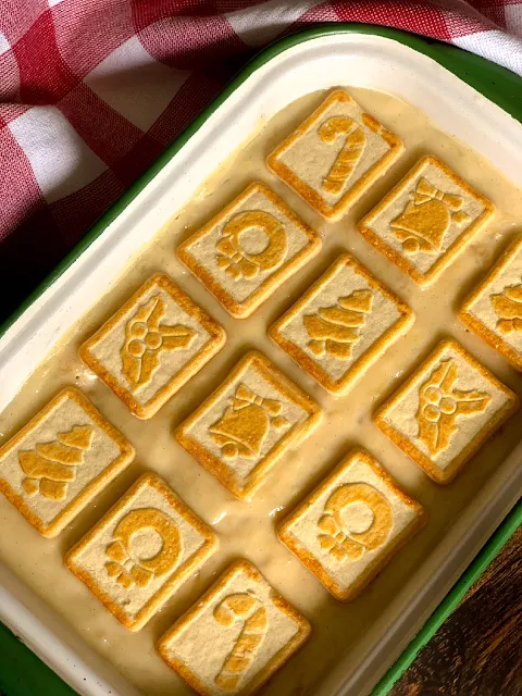 Pineapple Pudding, creamy, velvety homemade custard pudding layered between Pepperidge Farm Butter Cookies, classic southern.  Simply scrumptious, the Christmas Chessmen add a charming touch to the dessert during the holidays.