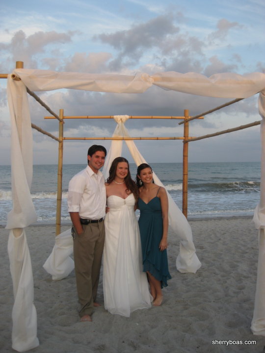 A beachside wedding arbor made from bamboo