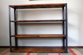 bookshelves made from recycled barn roofing boards