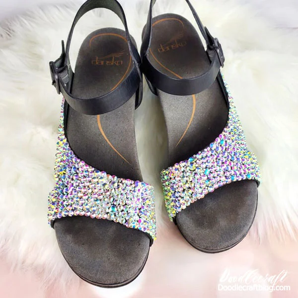 Make the most gorgeous rhinestone shoes with aurora borealis gemstones!   These stunning shoes are just what you need to wear to ring in the new year! I love wearing all kinds of sparkle--and New Year's Eve is the perfect excuse!   Just a couple hours and a pile of rhinestones is all it takes to take shoes from drab to fab!   Learn how to make rhinestone shoes for the perfect upgrade to a pair of shoes!