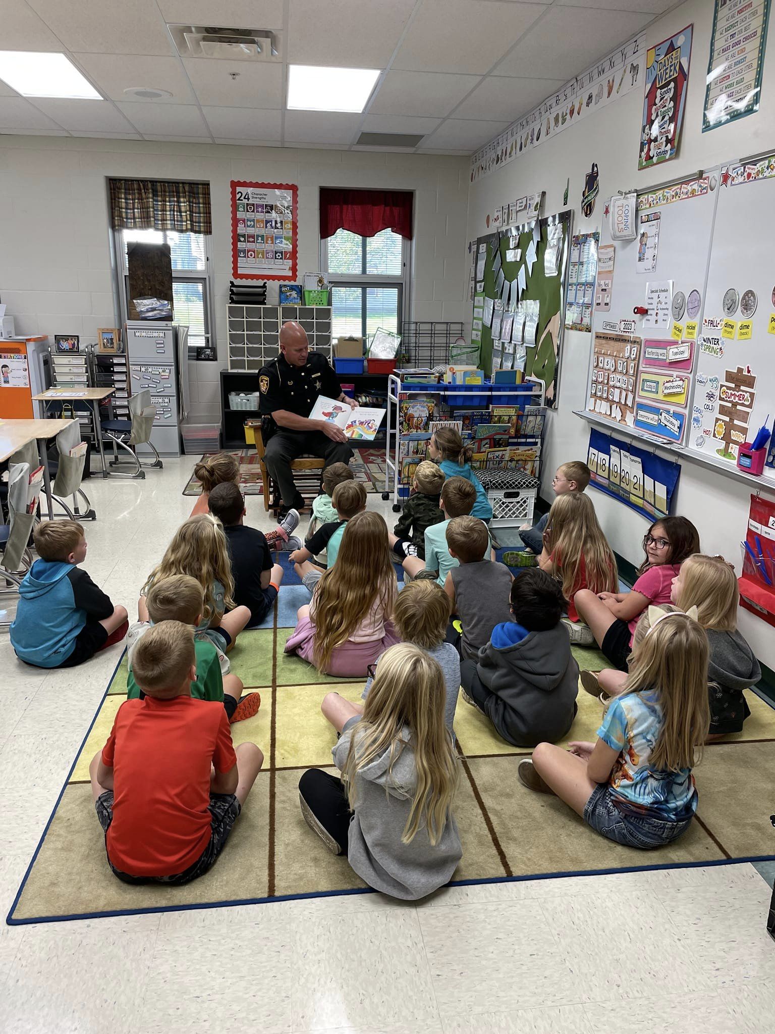 students listening to a book being read to them