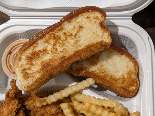 Raising Cane's Texas Toast with butter on both sides.