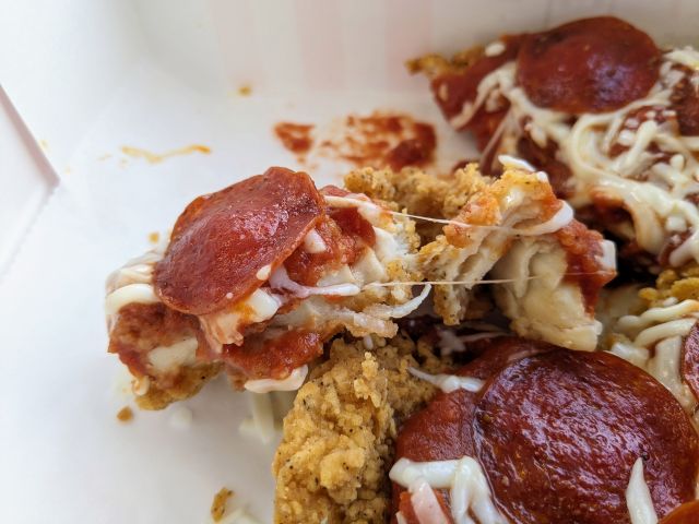 Close-up of a slice of KFC's Chizza.