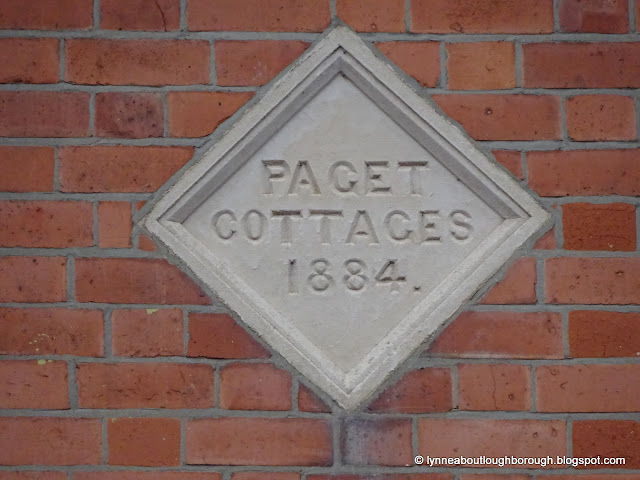 House name plaque bearing the words 'Paget Cottages 1884'