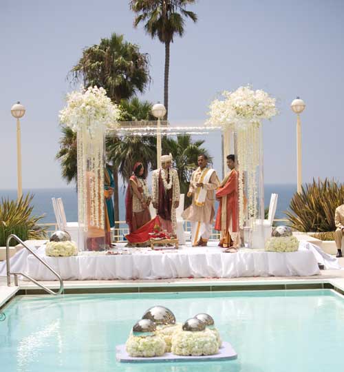 The ceremony took place poolside before sunset over looking the ocean