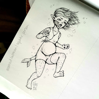 A photograph of a pen and ink drawing in a sketchbook. The drawing is of a pregnant water fairy, she is surprised.