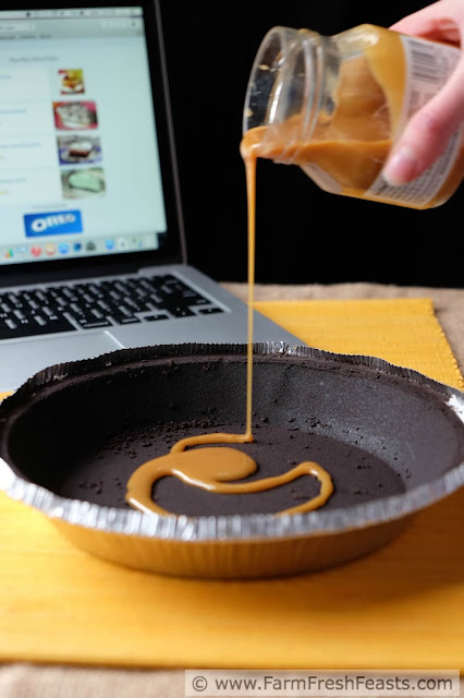 Recipe for caramel pumpkin butter swirled in a cheesecake, baked in an Oreo cookie crust covered with caramel. A deliciously festive Fall dessert.