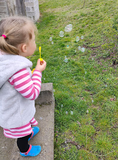 Rosie blowing bubbles