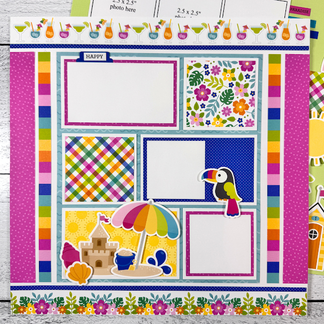 12x12 Living the Dream Summer Scrapbook Page Layout with a sandcastle, umbrella, seashells, cocktails, and a toucan bird