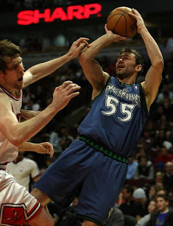 Minnesota Timberwolves #55 taking a jump Shot