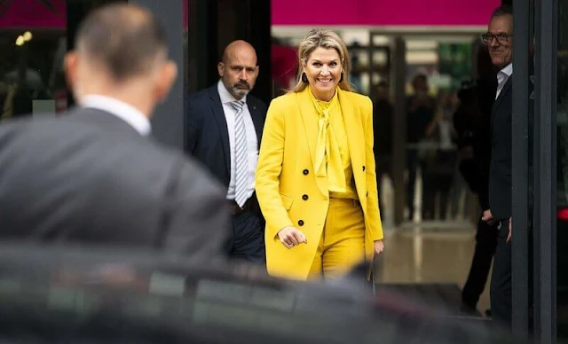 Queen Maxima wore a new yellow satin tie neck blouse by Zara. Yellow double breasted blazer and trousers by Zara