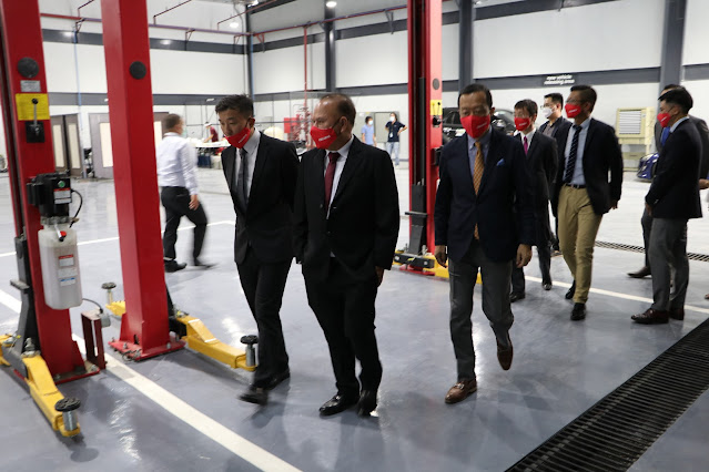 Subic Bay Metropolitan Authority (SBMA) Chairman and Administrator Rolen C. Paulino gets a tour of the facility along with other distinguished guests during the grand opening of the P220-million Isuzu Subic Full Scale Dealership.