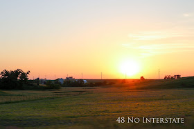 48 No Interstate back roads cross country coast-to-coast road trip Iowa farmland sunset barn